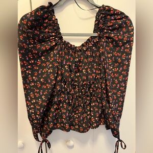 Black floral blouse. With red, pink and purple flowers.